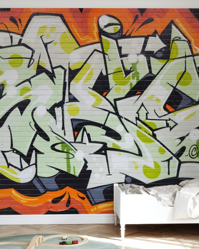 Tapet perete cu design graffiti pe un perete de caramida, in nuante de verde, negru si portocaliu.