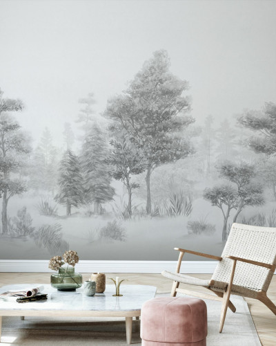 Tapet Bohemian Forest, BW, cu un design minimalist in tonuri de gri, cu o pădure liniștită, perfect pentru a crea o atmosferă relaxantă și sofisticată.  Se vede livingul cu canapea, scaun, masă de cafea și alte decorațiuni.