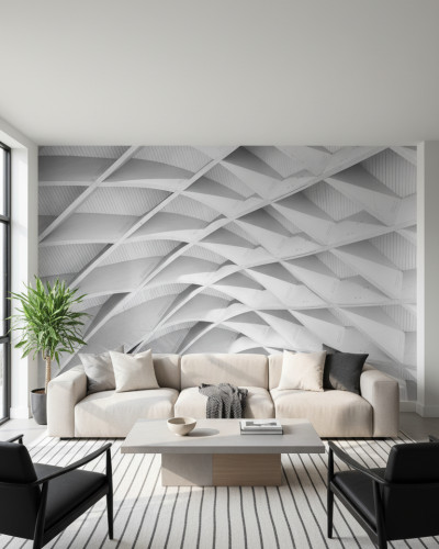 Fototapet modern Lineage Unveiled personalizat, cu model geometric 3D abstract în nuanțe de gri, aplicat pe peretele unui living minimalist cu canapea crem și mobilier contemporan.