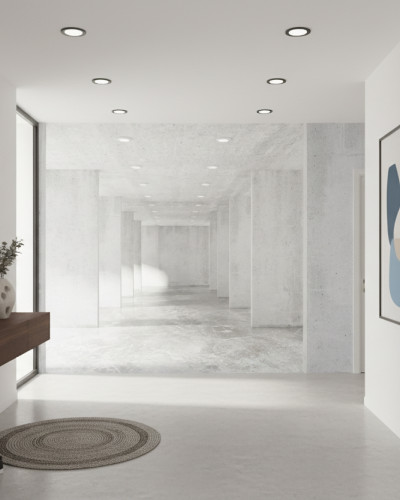 Fototapet personalizat Urban Loft Concrete într-un hol modern cu aspect industrial, pereți cu textură de beton, oglindă minimalistă, consolă flotantă din lemn și artă abstractă.