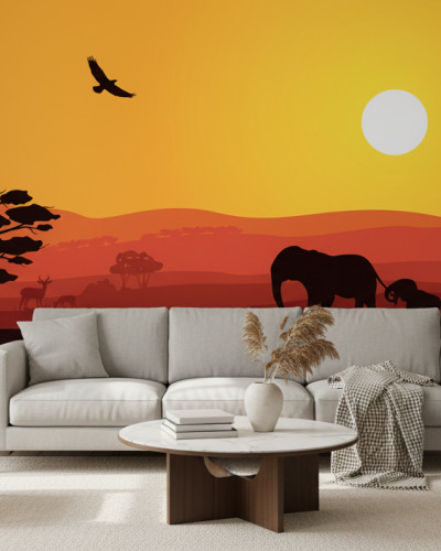 Fototapet personalizat cu siluete de elefanți, girafe și copaci pe fundalul unui apus african portocaliu-roșu, într-un living modern cu canapea gri și fotolii bej.