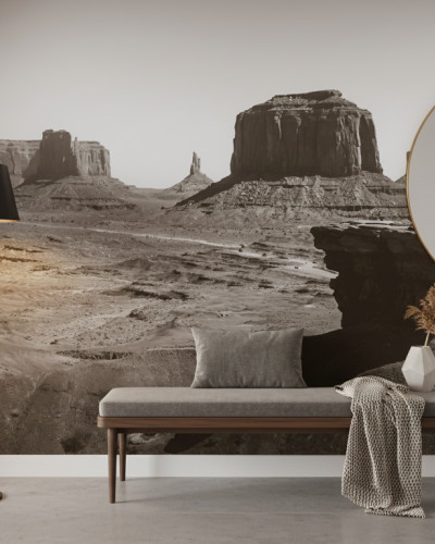 Fototapet personalizat Red Rock Vista, cu un peisaj deșertic vast, formațiuni stâncoase iconice și un cowboy călare, în tonuri sepia. Instalat într-un restaurant modern.