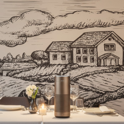 Customised Farmland Engraving Sketch photo wallpaper, illustrating a monochrome rural landscape with a farm and hills, decorating a wall in an elegant restaurant.