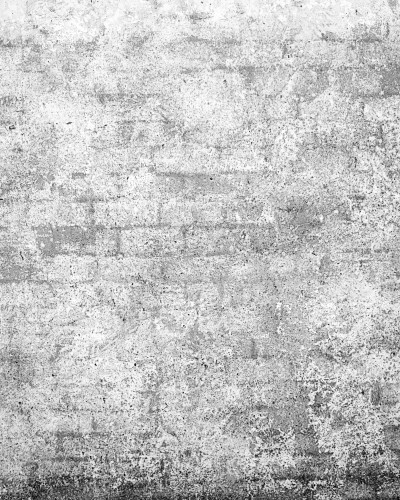 Tapet Urban Loft Brick personalizat cu aspect de cărămidă gri uzată, într-un living modern cu canapea albă, măsuță de cafea din beton și lampadar negru.